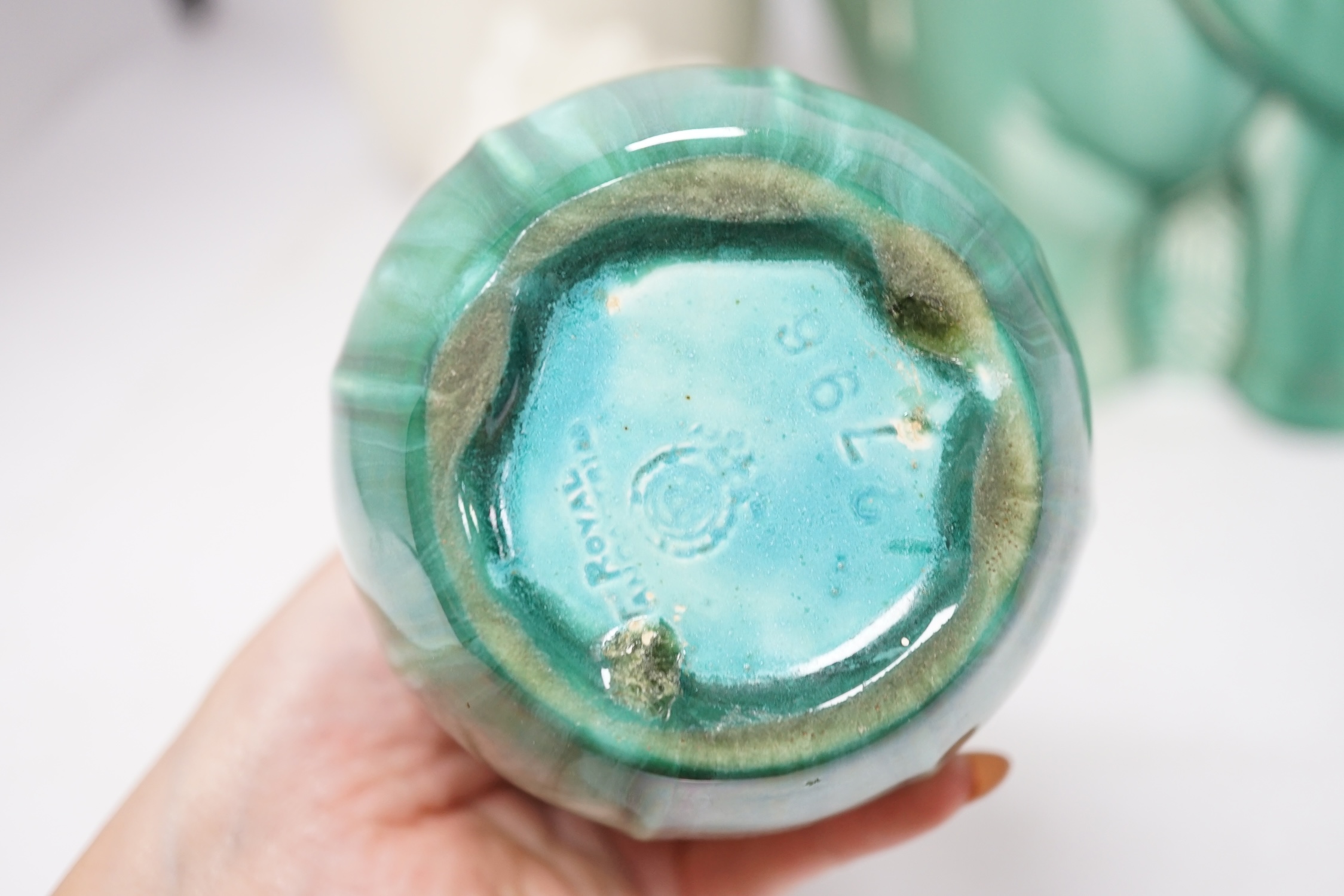 An Art Deco Spode's Royal Jade green glazed model of an elephant and four other pieces of Poole, Royal Lancastrian and Wedgwood, tallest 29cm. Condition - good